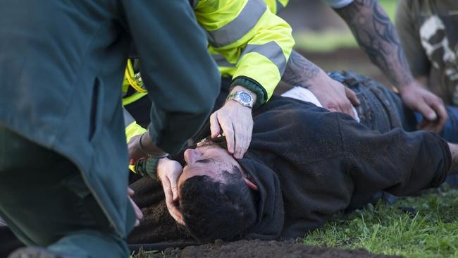 Helpers had to clear dirt from Antony Britton’s mouth and throat after his live burial stunt went horribly wrong. Picture: Paul Saripo/Escape for Life