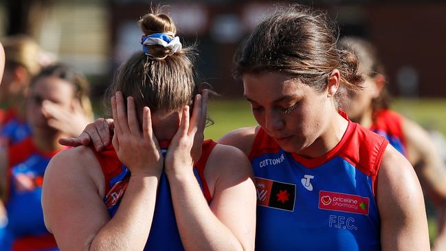 Jessica Fitzgerald and Ellie Blackburn look dejected after their one-point loss. Picture: Dylan Burns/AFL Photos via Getty Images