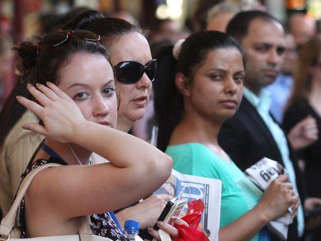 Hot and bothered and delayed commuters at Flinders st train station