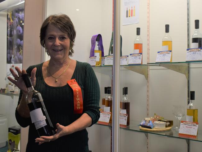 Val Lloyd, Ipswich, and Alan Brown, Bellbird Park, at the Ipswich Show after winning awards for their respective bottles of wine. Picture: Ebony Graveur