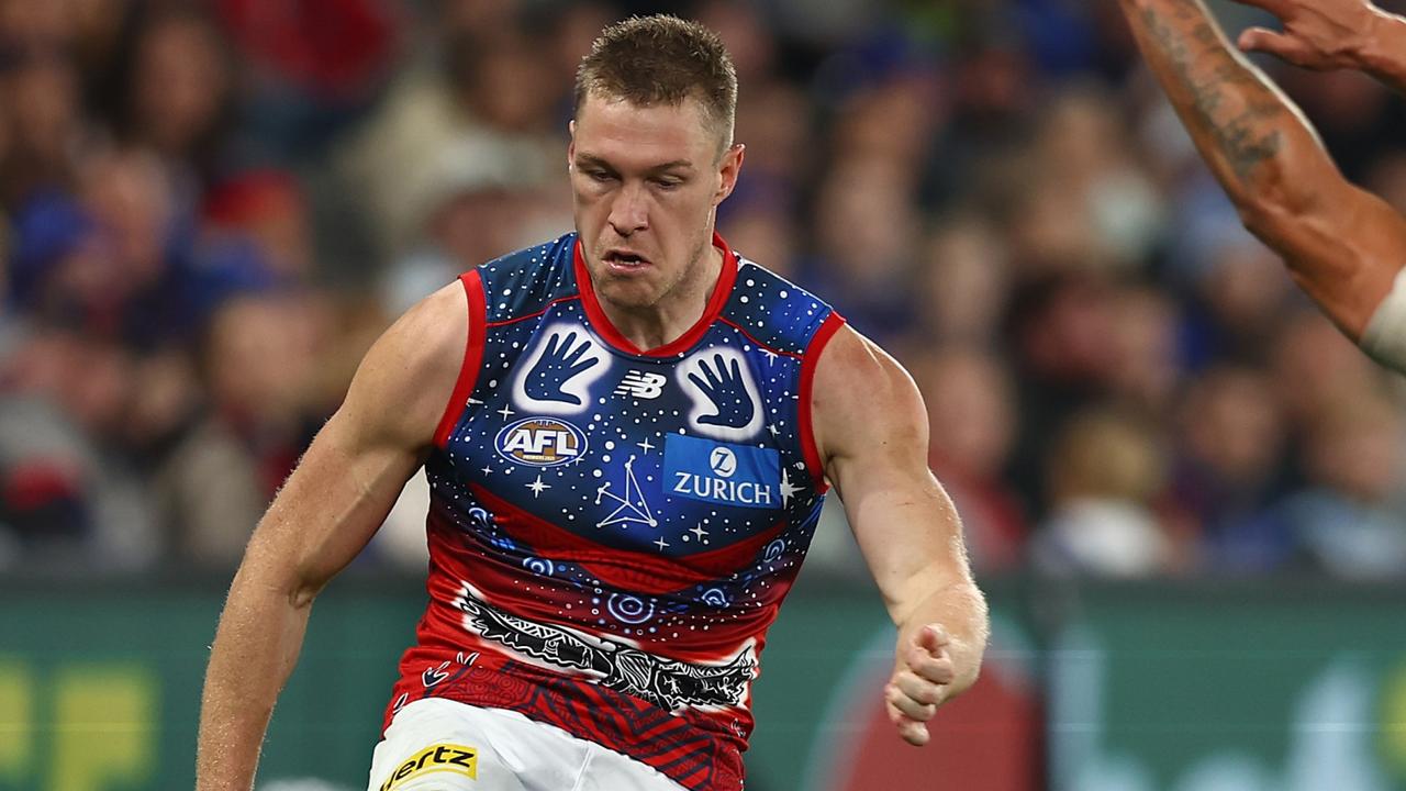 MELBOURNE, AUSTRALIA - MAY 21: Tom McDonald of the Demons kicks ahead during the round 10 AFL match between the North Melbourne Kangaroos and the Melbourne Demons at Marvel Stadium on May 21, 2022 in Melbourne, Australia. (Photo by Graham Denholm/Getty Images)