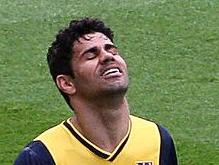 Atletico Madrid's Brazilian-born forward Diego da Silva Costa reacts to the recurrence of a hamstring injury during the Spanish league football match FC Barcelona vs Club Atletico de Madrid at the Camp Nou stadium in Barcelona on May 17, 2014. AFP PHOTO/ QUIQUE GARCIA