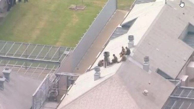 Prisoners on the roof of a building at Borallon Correctional Centre west of Brisbane. Picture: 9 News Queensland