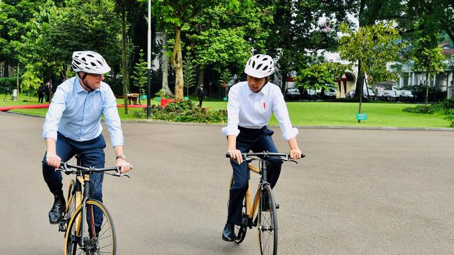 Indonesia’s President Joko Widodo and Prime Minister Anthony Albanese ride bamboo bicycles at the Presidential Palace in Bogor, West Java, during the PM’s recent visit.