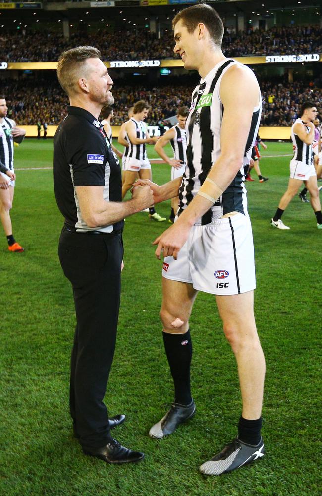 Magpies coach Nathan Buckley speaks to Mason Cox after the AFL preliminary final win over the Tigers. Picture: Michael Dodge/AFL Media/Getty Images