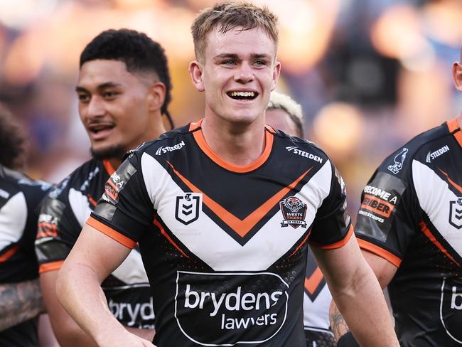 SYDNEY, AUSTRALIA - APRIL 01:  Lachlan Galvin of the Tigers celebrates victory with team mates after the round four NRL match between Parramatta Eels and Wests Tigers at CommBank Stadium, on April 01, 2024, in Sydney, Australia. (Photo by Matt King/Getty Images)