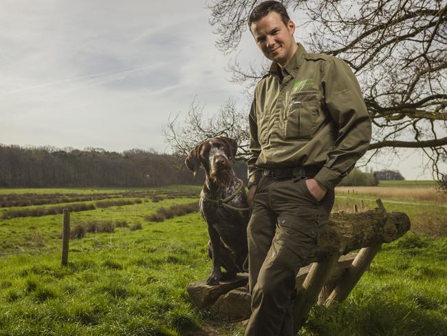 Even Brabant forest ranger Erik de Jonge’s dog looks incredulous about the illegal dumping of toxic waste in the forest. Picture: Nick Franken