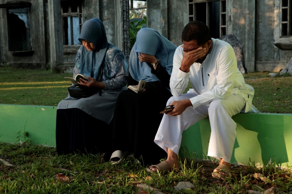 Tears, prayers as Asia mourns tsunami dead 20 years on