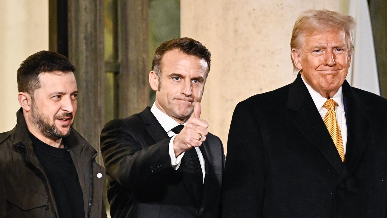 France's President Emmanuel Macron (C) flanked by US president-elect Donald Trump, right, and Ukraine's President Volodymyr Zelensky. Picture: AFP.