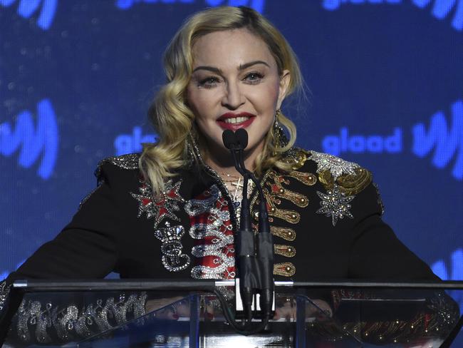 FILE - In this May 4, 2019, file photo, honoree Madonna accepts the advocate for change award at the 30th annual GLAAD Media Awards at the New York Hilton Midtown in New York. Madonna has cancelled the last two stops of her latest tour in France after the country said it was banning events of more than 1,000 people to limit the spread of the coronavirus. A statement posted onto the pop star's website on Monday, March 9, 2020, says her March 10-11 shows in Paris would not take place. (Photo by Evan Agostini/Invision/AP, File)