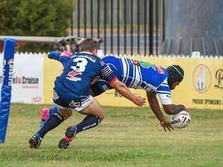 Benaiah Kambanei flies over the line for Past Brothers. Picture: Brian Cassidy