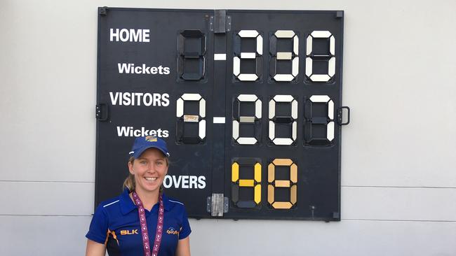 Sandgate-Redcliffe player Jemma Barsby at the grand final winning scoreboard.