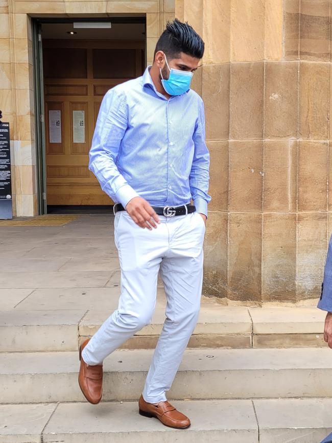 Raman Sharma leaves the Adelaide Magistrates Court.