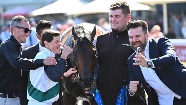 Mr Brightside’s connections celebrate with Craig Williams. Picture: Vince Caligiuri/Getty Images