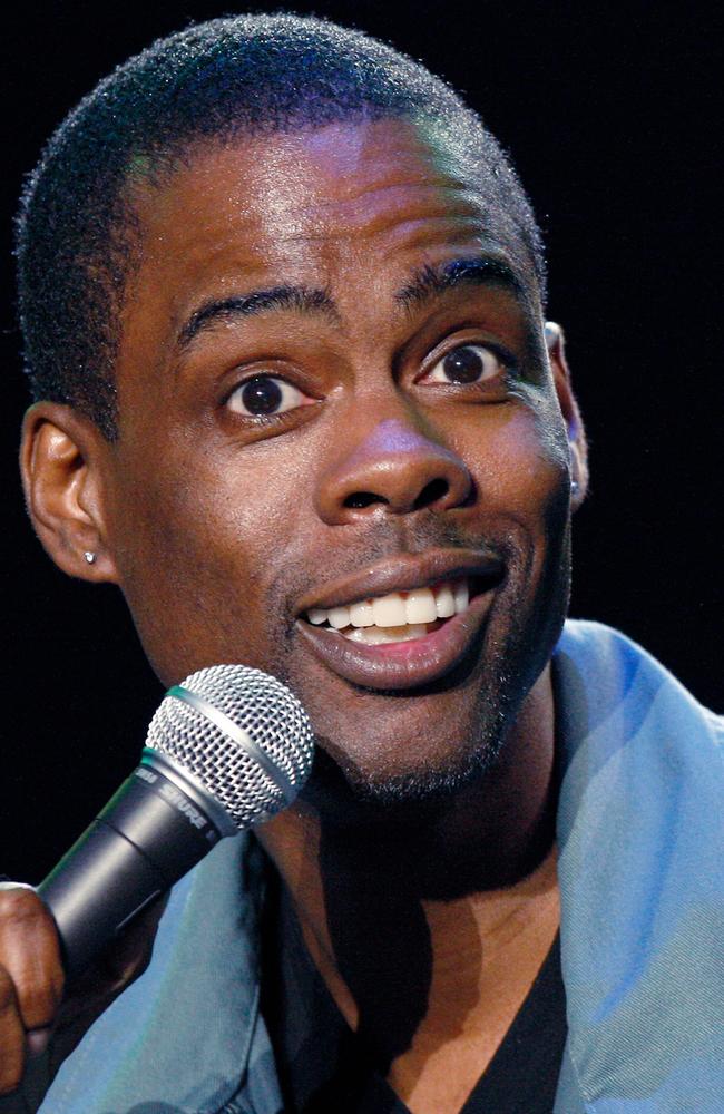 ** FILE ** In this June 13, 2008 file photo, Chris Rock performs at the Bonnaroo Music and Arts Festival 2008 in Manchester, Tenn. The award-winning comedian has a deal with Grand Central Publishing for a book, currently untitled but full of 
