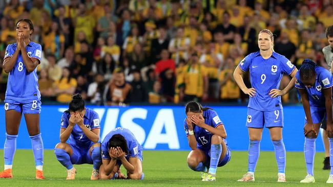 The French players cannot watch during the tense penalty shootout against Australia. Picture: Adam Head