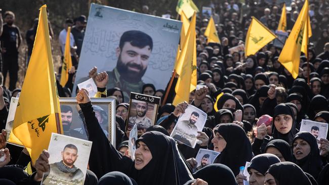 Women march and chant slogans for a killed Hezbollah fighter in Lebanon. Picture: Chris McGrath/Getty Images)