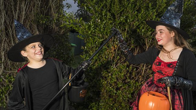 Hannah Paton (left) and Elodie Fairbanks-Smith trick or treating on Halloween in Newtown, Sunday, October 31, 2021. Picture: Kevin Farmer