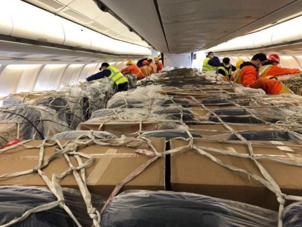 Cargo is packed into the cabin of a Lufthansa A330 aircraft, usually used for passengers, as airlines find ways to increase revenue using empty aircraft.
