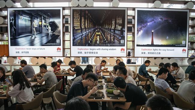 Huawei workers eat at a cafeteria at the company's Bantian campus in Shenzhen, China. Picture: Kevin Frayer