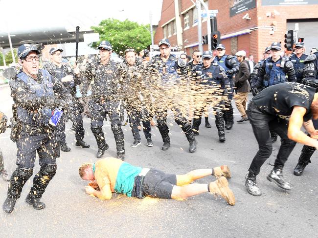 Protesters clash police in Kensington, Melbourne on Monday, after public speaker Milo Yianopoulos arrived. Picture: AAP