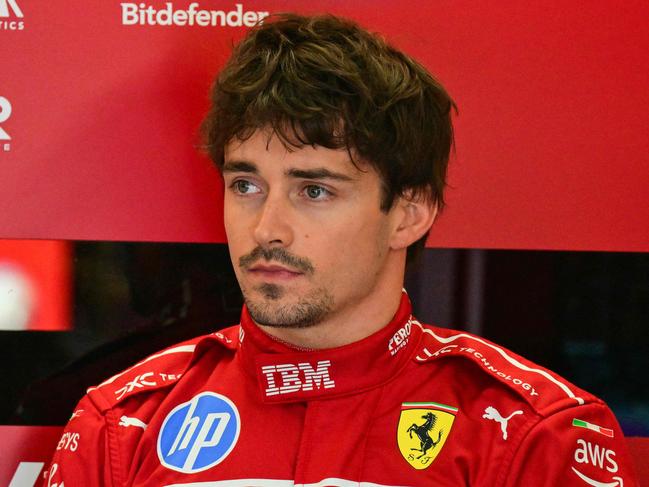 Ferrari's Monegasque driver Charles Leclerc looks on from the box before the 2025 Emilia Romagna Formula One Grand Prix at the Imola autodrome in Imola, on May 18, 2025. (Photo by Andrej ISAKOVIC / AFP)