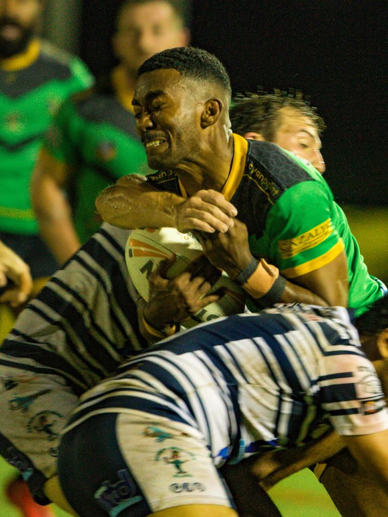 Palmerston Raiders Tevita Kanalagi pushes through two Darwin Brothers defenders in the 2022 NRL NT A-Grade prelim final. Picture: Glenn Campbell