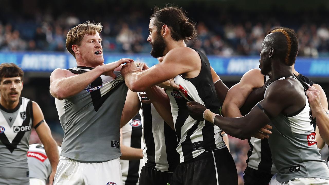 Brodie Grundy remonstrates with Tom Jonas.