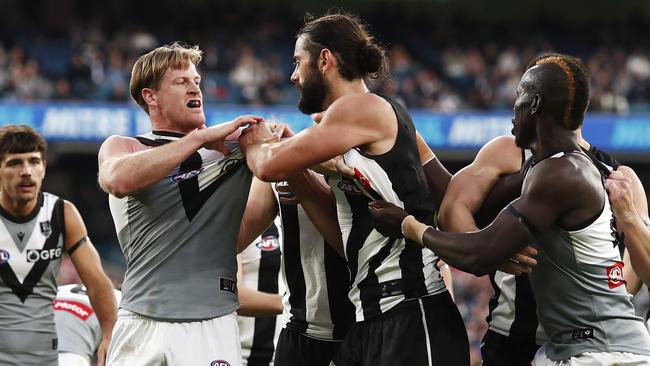 Brodie Grundy remonstrates with Tom Jonas.