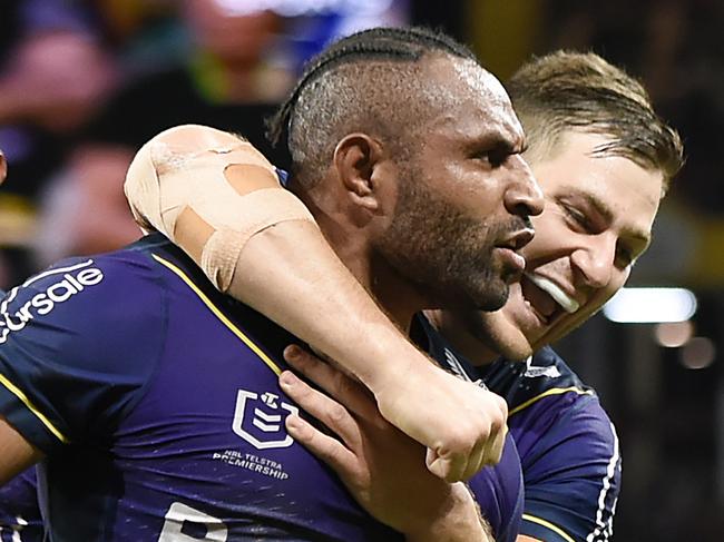 BRISBANE, AUSTRALIA - MAY 16: Justin Olam of the Storm celebrates with team mates after scoring a try during the round 10 NRL match between the Melbourne Storm and the St George Illawarra Dragons at Suncorp Stadium, on May 16, 2021, in Brisbane, Australia. (Photo by Albert Perez/Getty Images)