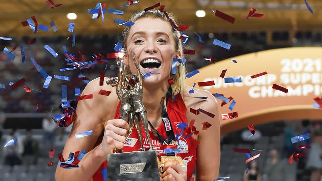 NSW Swifts goal attack Helen Housby with the trophy after her team's victory in the 2021 Super Netball Grand Final match between Sydney Swifts and GWS Giants at Nissan Arena, in Brisbane, on Saturday. Picture: Albert Perez/Getty Images