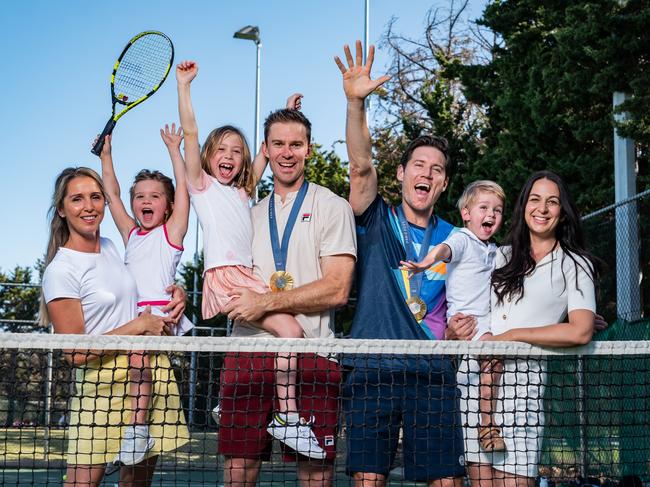 Kim and John Peers with Harper and Ellie alongside Matthew Ebden with Danielle and Harvey. Picture: Tony McDonough