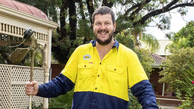 8,April, 2024: Woodville-West Torrens footballer Jarrad Redden doing his lawn mowing rounds which has helped him drop 15kg. Picture: Kelly Barnes