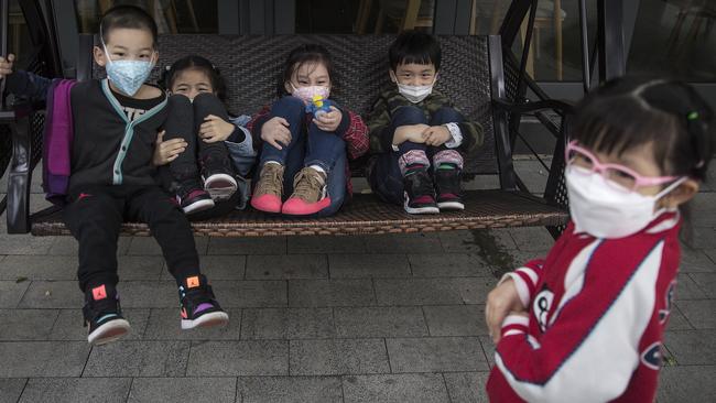 Children play in a shopping chair in the Chinese city of Wuhan, the epicentre of the coronavirus outbreak. Picture: Getty Images