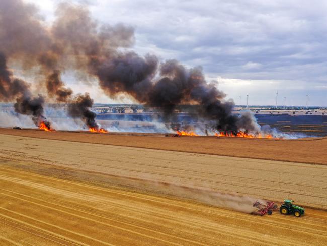 A German farmer uses a tractor to plough a protective strip into a cornfield during a field fire near Lutzen. Picture Jan Woitas / DPA / Picture Alliance via Getty Images