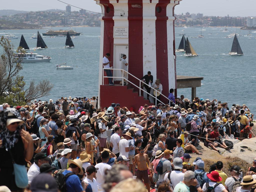 Crowds gather near Hornby Lighthouse on South Head at the start of the race. 2019 Rolex Sydney to Hobart Crowds watching the race as the Yachts pass through the heads. Picture: Rohan Kelly