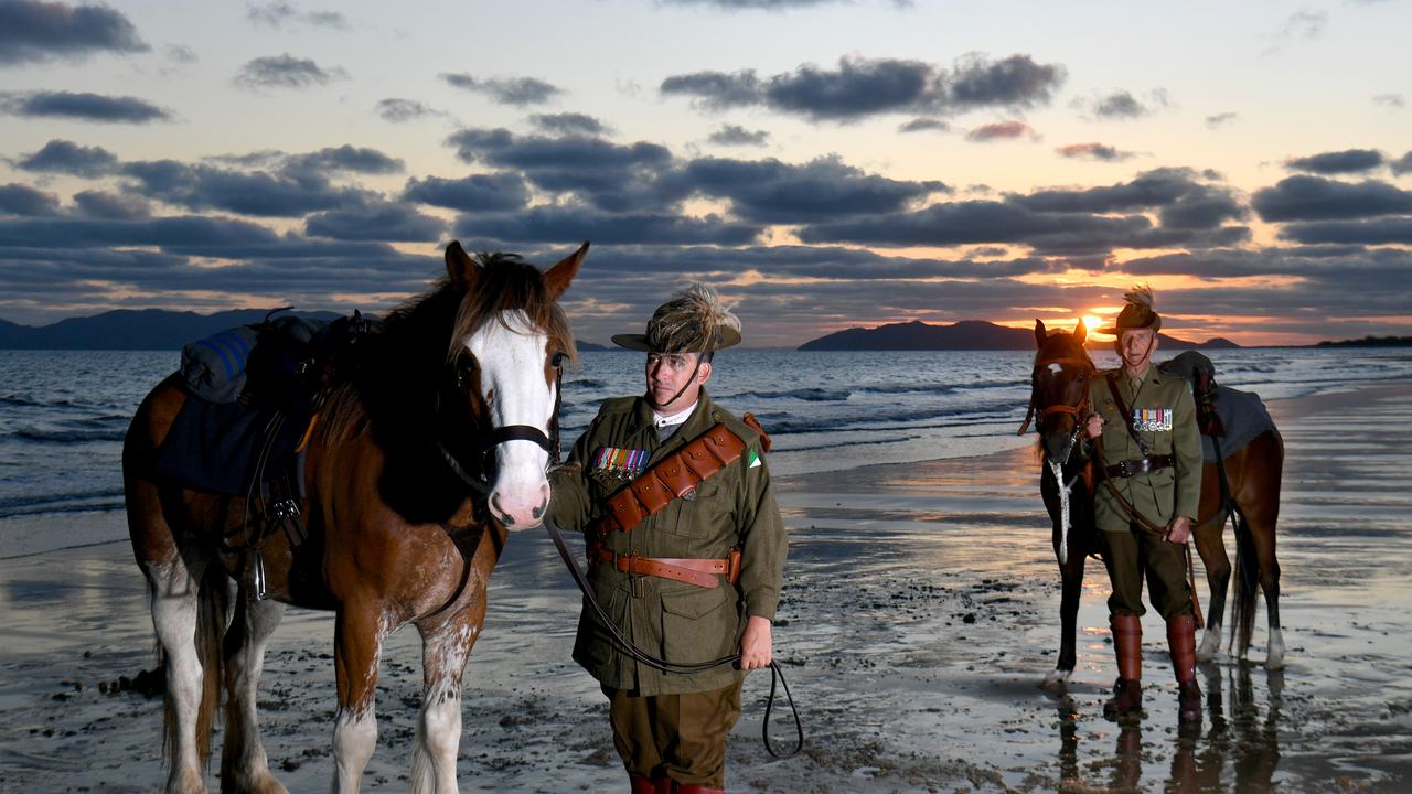 Veteran Jason Mengel with Gabriel and his dad Vietnam Veteran Lester Mengel from the 27th Lighthorse Regiment with Sox at dawn at Saunders Beach will be on parade for Remembrance Day. Picture: Evan Morgan