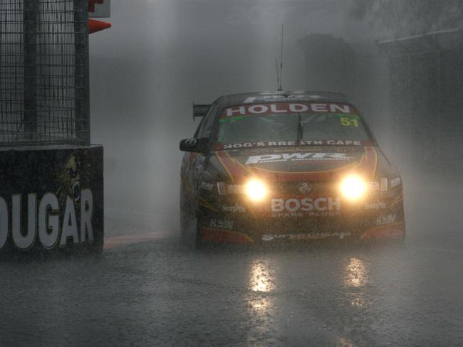 Greg Murphy pictured driving with his lights on during heavy rain at the Gold Coast Supercars race. Picture: Pic Derek Moore