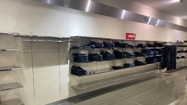 Shoppers cleaned out items at Toowong Village such as heavily-reduced jeans.