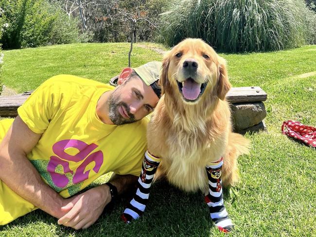 Brodie Grundy with Sam the golden retriever. Picture: Instagram