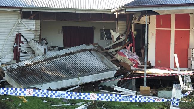 Police have tasered a man and deployed dogs after he allegedly assaulted them in the aftermath of a crash in which a car ploughed into a house south of Brisbane, injuring a woman and her two children. Picture: Jerad Williams