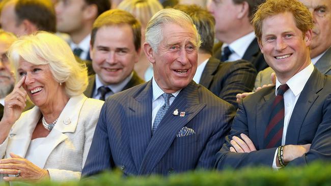 Prince Harry with Camilla and then Prince Charles, at the Invictus Games Opening Ceremony in 2014. Picture: Getty Images.