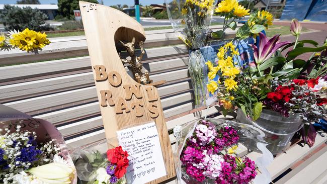 Flowers and tributes for Khai have been left on a bench on the esplanade at Seaford Beach. Picture: Morgan Sette