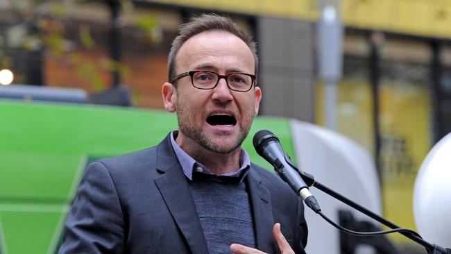 Federal Member for Melbourne Adam Bandt speaks at a rally organised by the National Student Union at the State Library in Melbourne, Wednesday, May 17, 2017. The protest is part of a National Day of Action against the federal budget plan to cut almost $4 billion from higher education. (AAP Image/Joe Castro) NO ARCHIVING