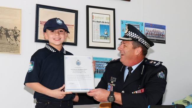 Special Junior Constable Christopher was sworn into the Service by Superintendent Garrath Channells. Picture: QPS