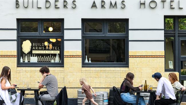 People enjoy a meal and drinks outside the Builders Arms Hotel in Fitzroy as Melbourne eases out of lockdown. Picture : NCA NewsWire / Ian Currie