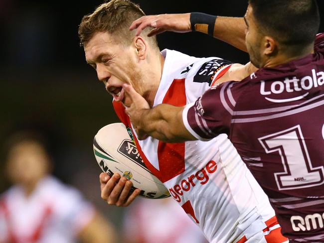 WOLLONGONG, AUSTRALIA - JUNE 16: Cameron McInnes of the Dragons is tackled during the round 15 NRL match between the St George Illawarra Dragons and the Manly Sea Eagles at WIN Stadium on June 16, 2018 in Wollongong, Australia.  (Photo by Mark Nolan/Getty Images)