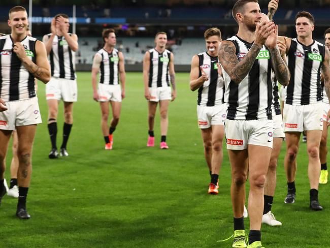 MELBOURNE, AUSTRALIA - MARCH 25: The Magpies celebrate after they defeated the Blues during the round 2 AFL match between the Carlton Blues and the Collingwood Magpies at the Melbourne Cricket Ground on March 25, 2021 in Melbourne, Australia. (Photo by Robert Cianflone/Getty Images)