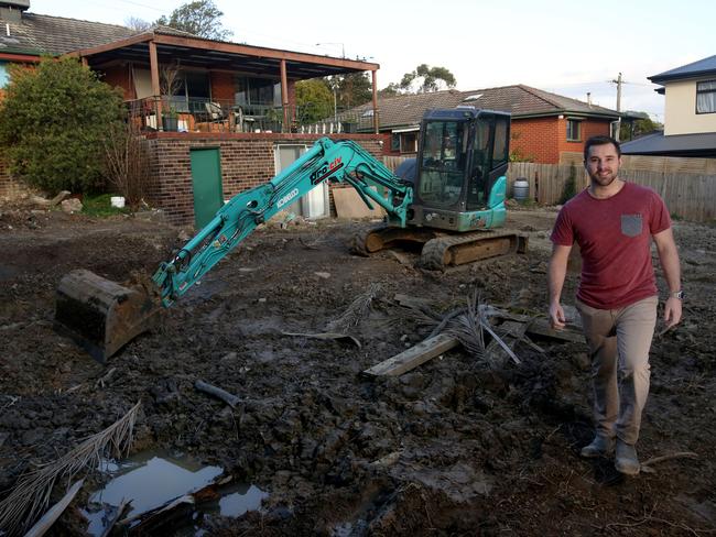 Ryan Evans in the backyard of a property he is subdividing on Manchester Rd, Mooroolbark. Picture Stuart Milligan