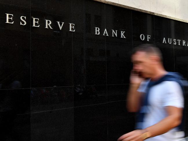 A pedestrian walks past the Reserve Bank of Australia (RBA) building in Sydney, Tuesday, February 4, 2020. (AAP Image/Joel Carrett) NO ARCHIVING